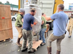 Cordovan Citizens Unloading a Fermenter