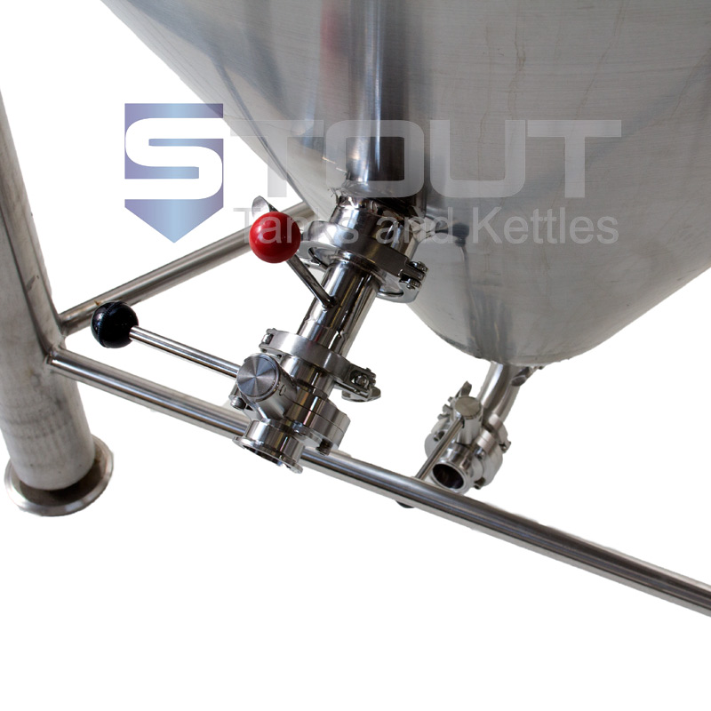 Close up view of the racking arm and butterfly valves on a 30 BBL fermenter used in commercial brewing